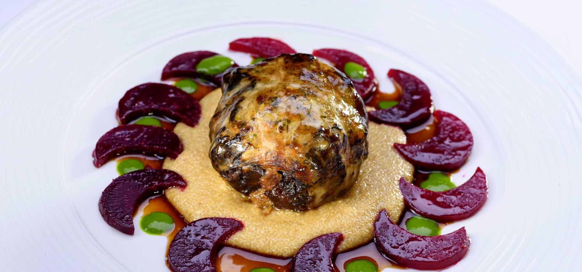 Cream cheese parfait with wild garlic served on a plate from the Romantik Hotel | Restaurant Hirsch in the Swabian Alb